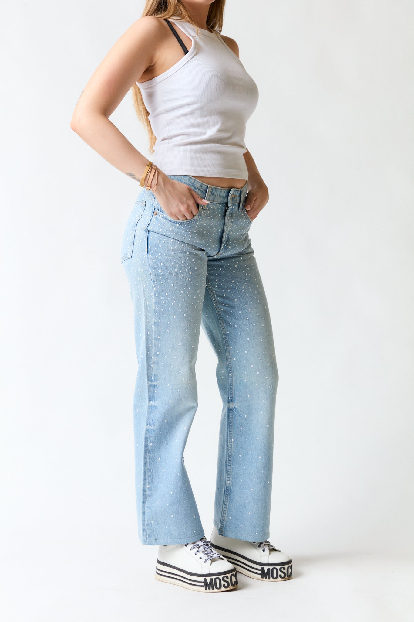Pantalón denim con perlas | Zara