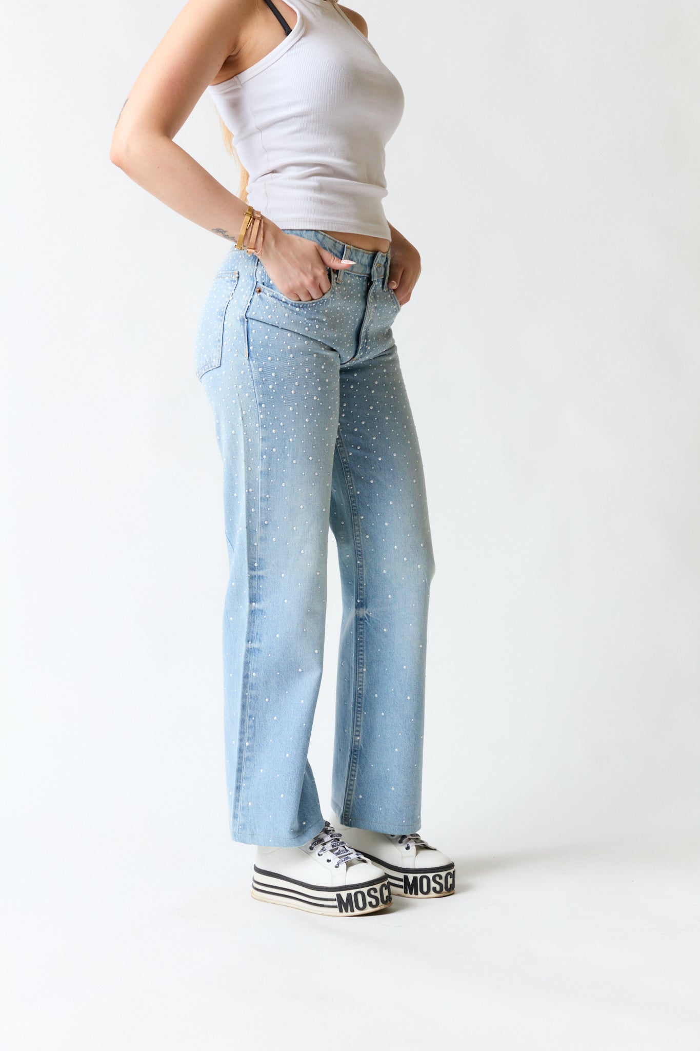 Pantalón denim con perlas | Zara