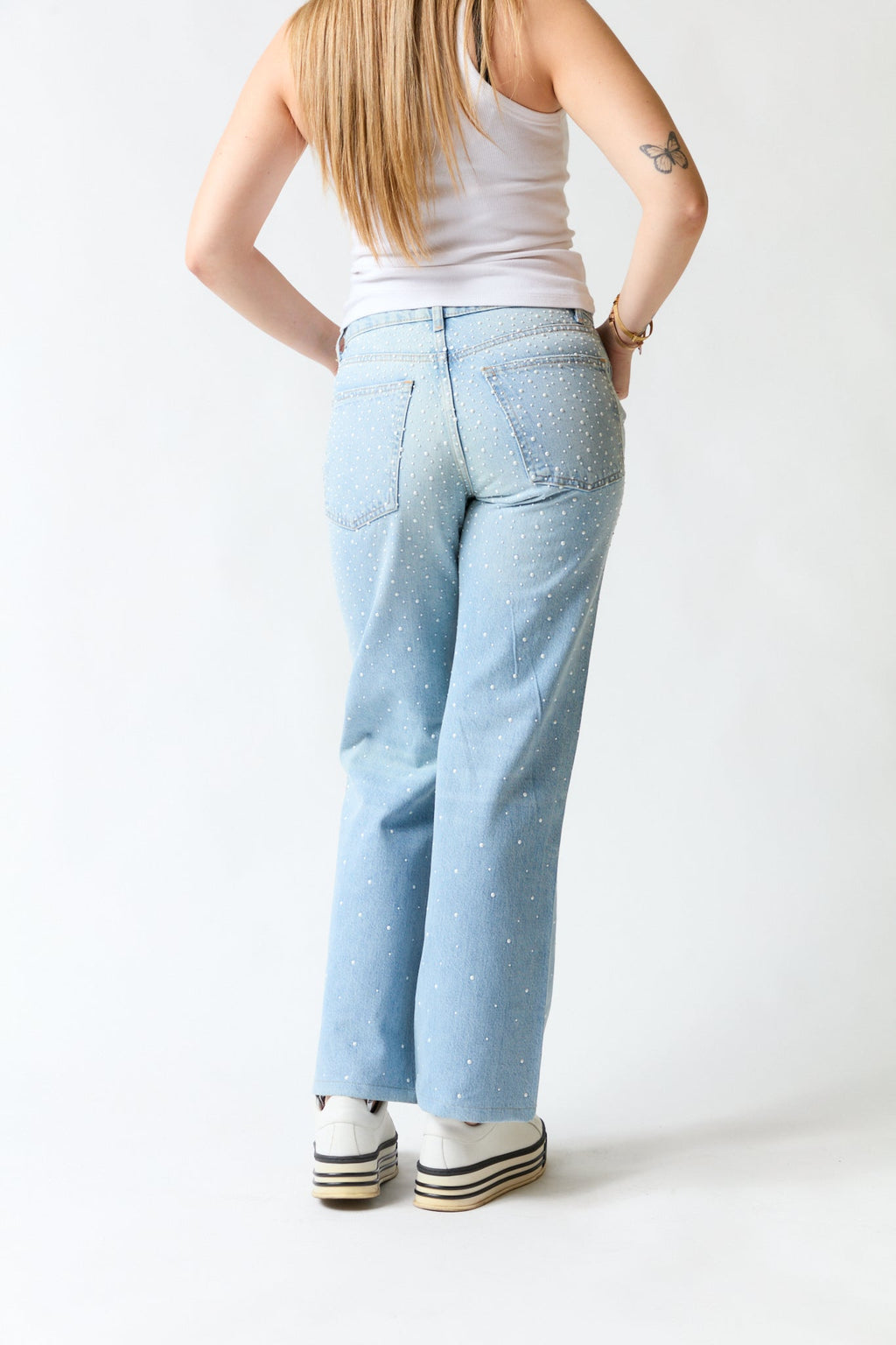 Pantalón denim con perlas | Zara