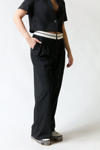 Pantalón negro con blanco | Stradivarius