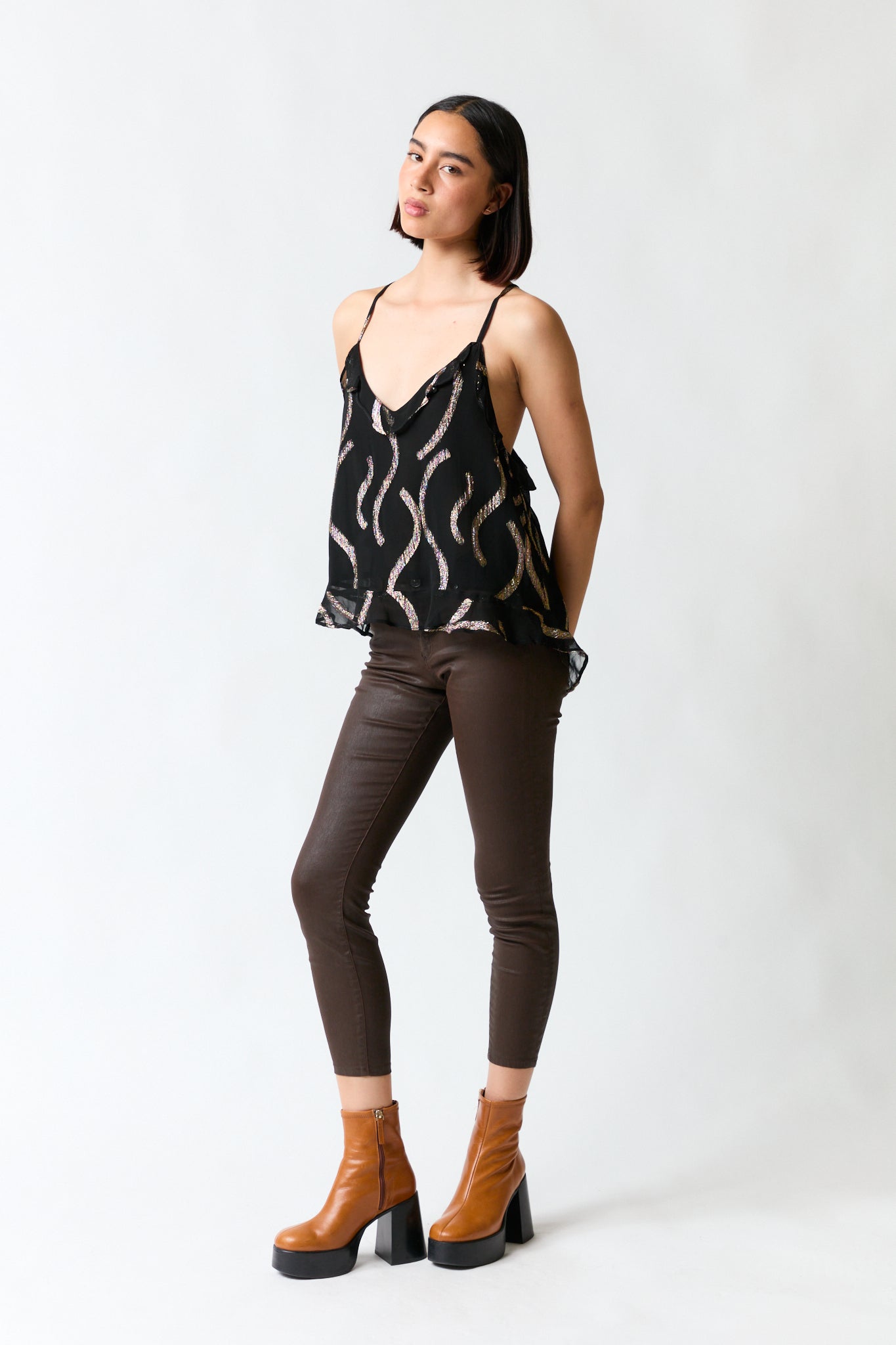 Polera vuelitos negro con dorado | Rapsodia