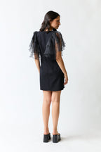 Vestido negro con vuelitos | Zara